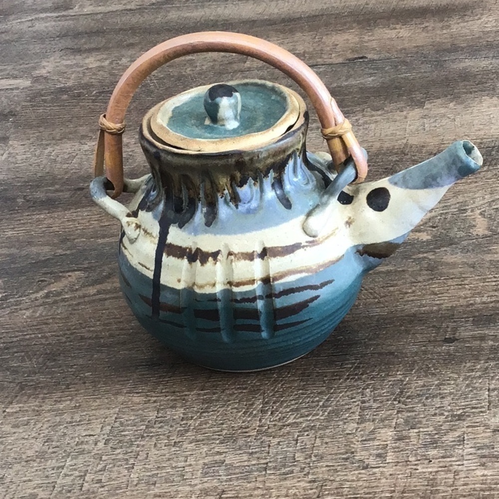 Clay teapot signed by Isaac Martin